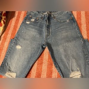 Female 501’s dark blue with rips